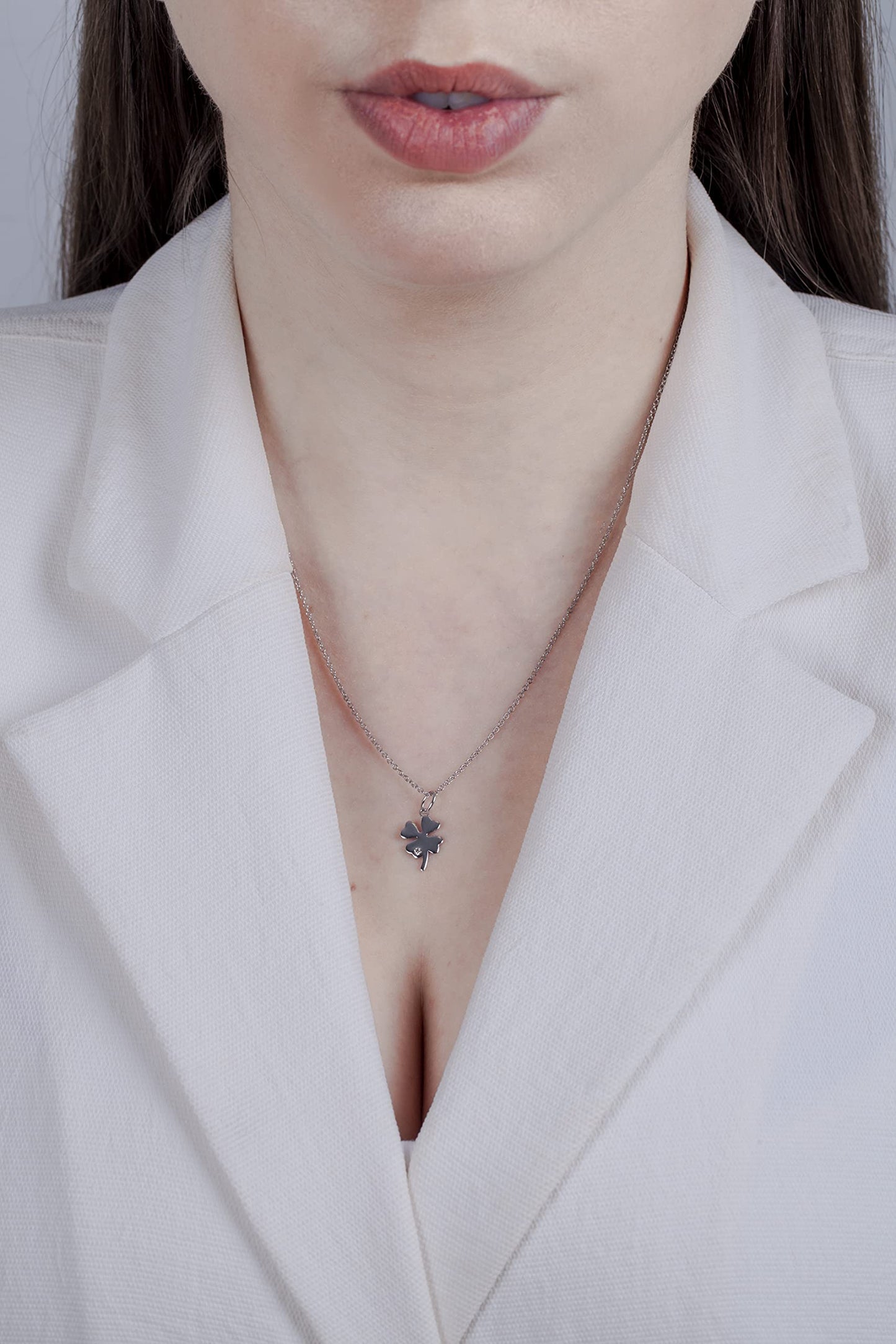 model picture of a woman wearing a sterling silver clover canadian diamond necklace.