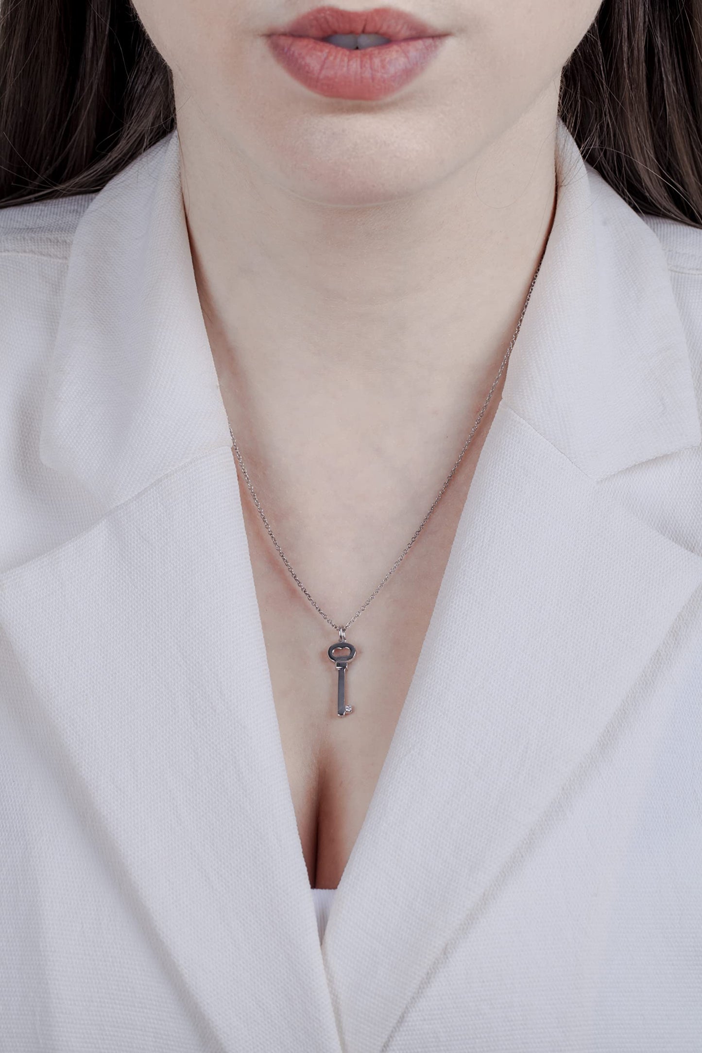 Picture of model wearing Sterling silver key pendant.