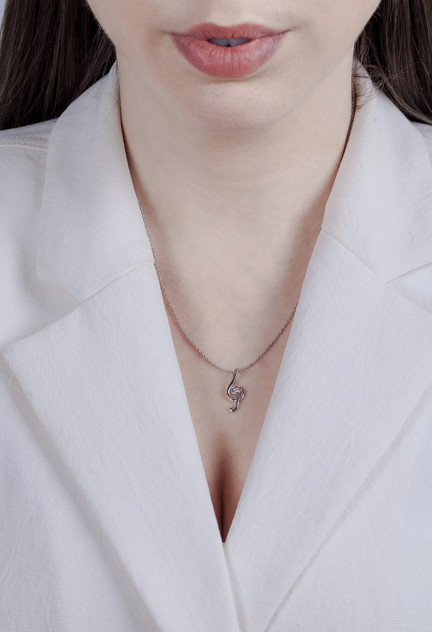 picture of model wearing a music note pendant necklace with Canadian diamond.