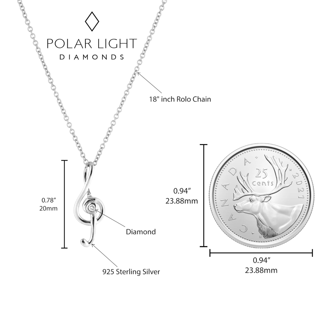 Music note sterling silver necklace with Canadian quarter as size reference.