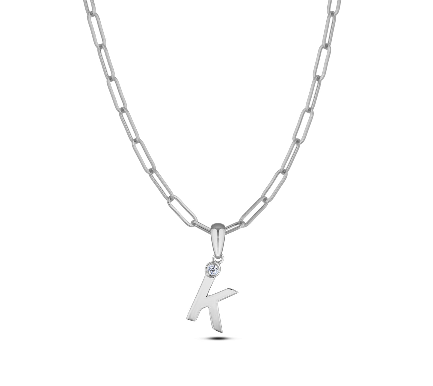 Sterling silver Canadian diamond pendant necklace featuring a black style letter K design, displayed on a matching silver paperclip chain.

