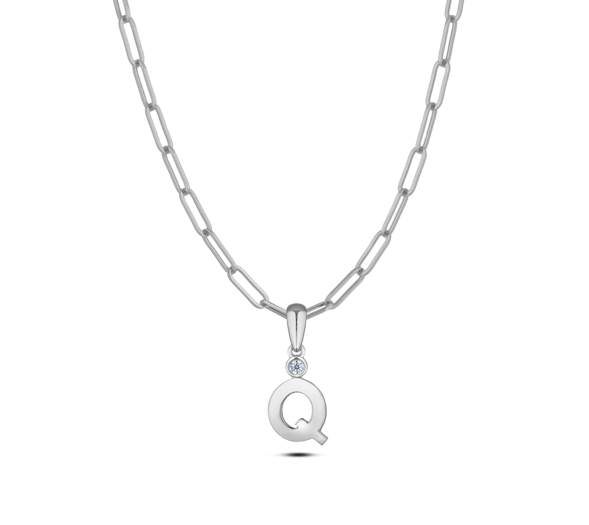 Sterling silver Canadian diamond pendant necklace featuring a black style letter Q design, displayed on a matching silver paperclip chain.

