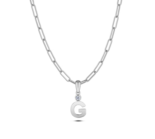Sterling silver Canadian diamond pendant necklace featuring a black style letter G design, displayed on a matching silver paperclip chain.

