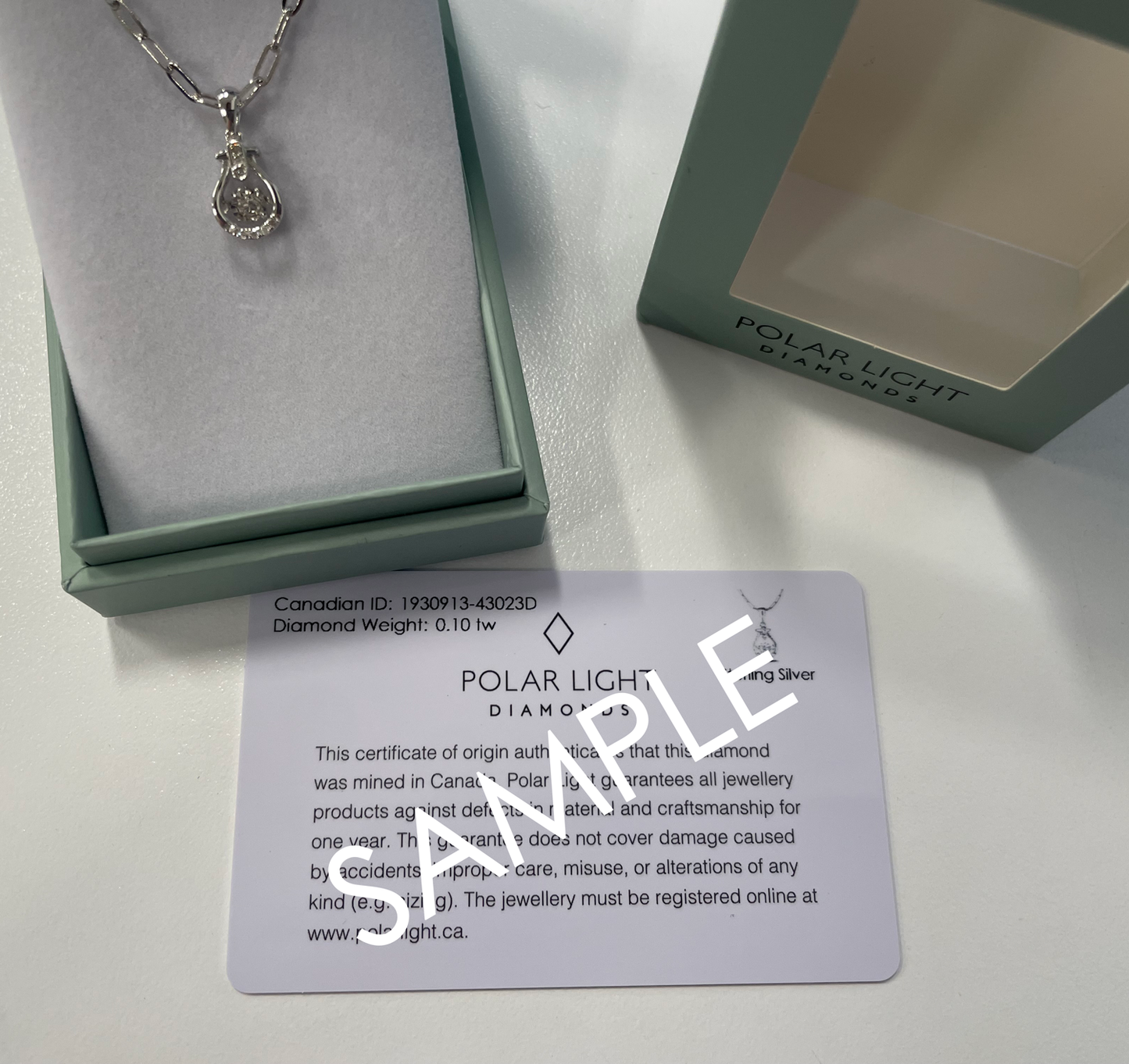 925 Sterling Silver 0.13 Cttw Canadian Diamond Infinity Pendant with Center Dancing Diamond with Paperclip Chain with a Polar Light Diamonds box packaging and Canadian Diamond ID cert.