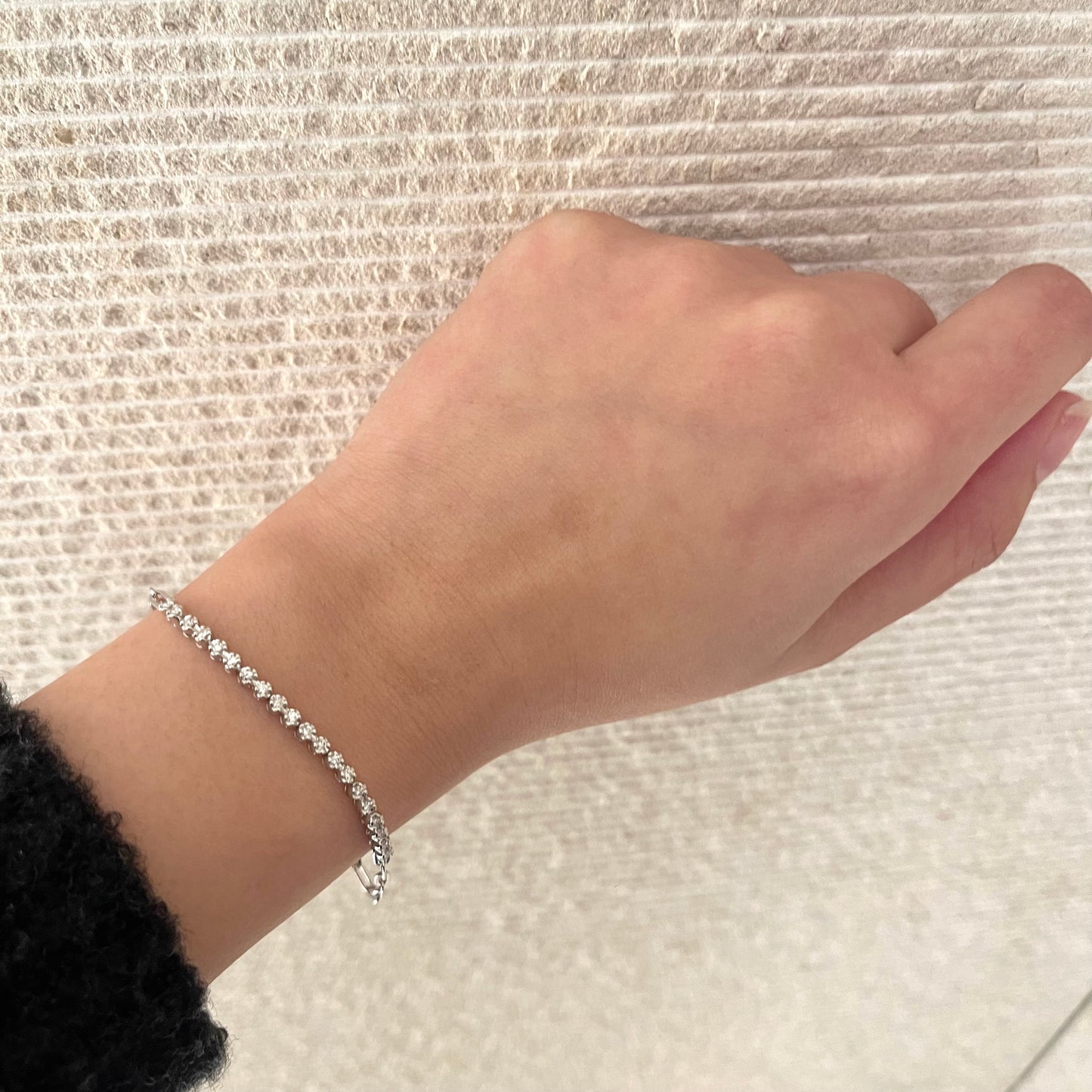 Paperclip sterling silver half tennis bracelet with round brilliant cut Canadian diamonds on a wrist