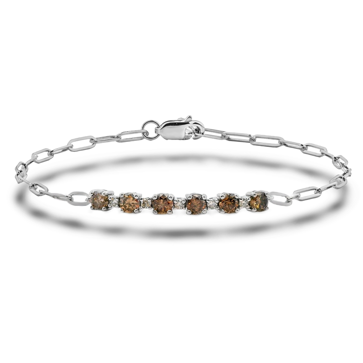 High-polish sterling silver paperclip link bracelet featuring eleven Canadian diamonds. Five white diamonds and six warm coffee diamonds alternate along the center links, creating a patterned contrast. Shown against a clean white background.