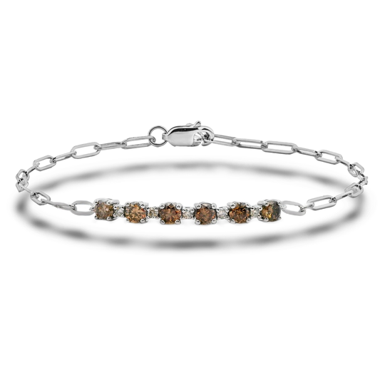High-polish sterling silver paperclip link bracelet featuring eleven Canadian diamonds. Five white diamonds and six warm coffee diamonds alternate along the center links, creating a patterned contrast. Shown against a clean white background.