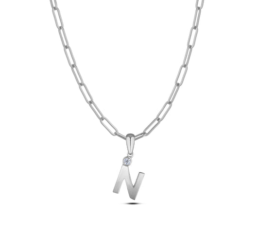 Sterling silver Canadian diamond pendant necklace featuring a black style letter N design, displayed on a matching silver paperclip chain.
