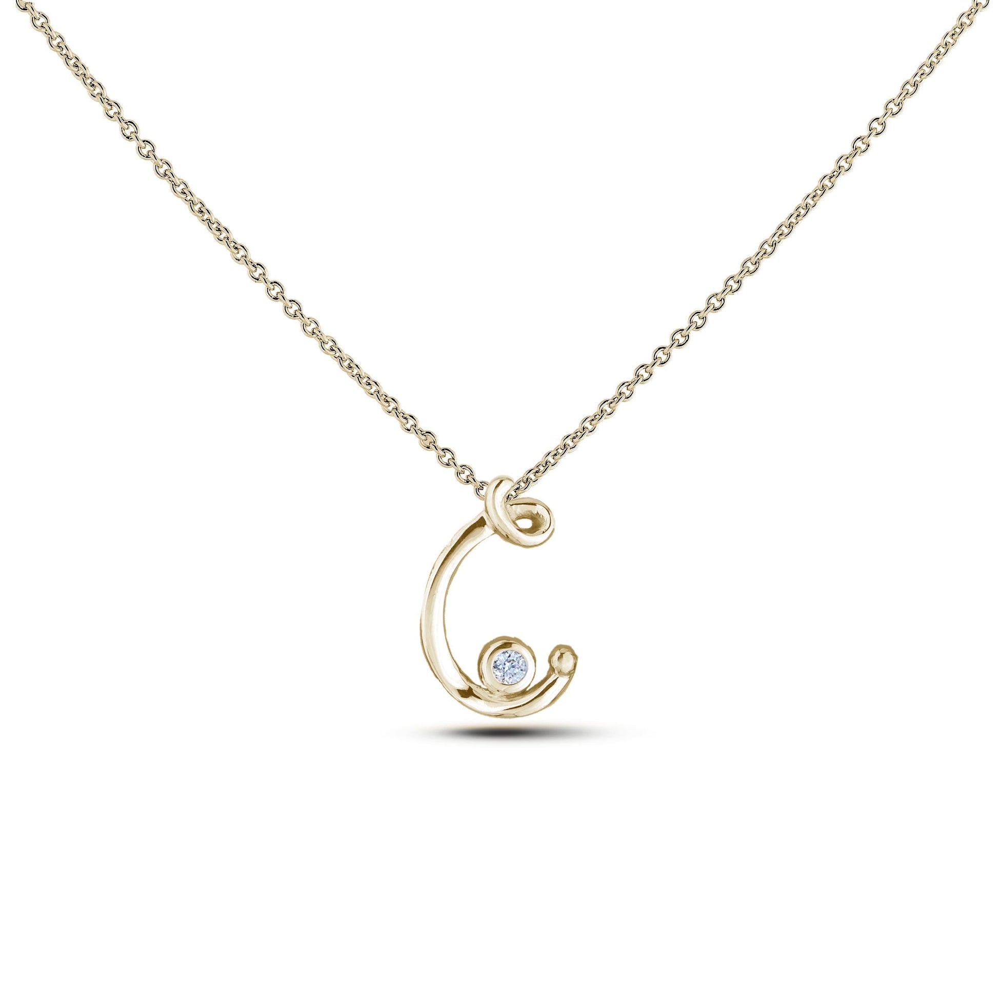 Yellow Gold Canadian diamond pendant necklace featuring a script alphabet letter C design, displayed on a matching silver rolo chain.

