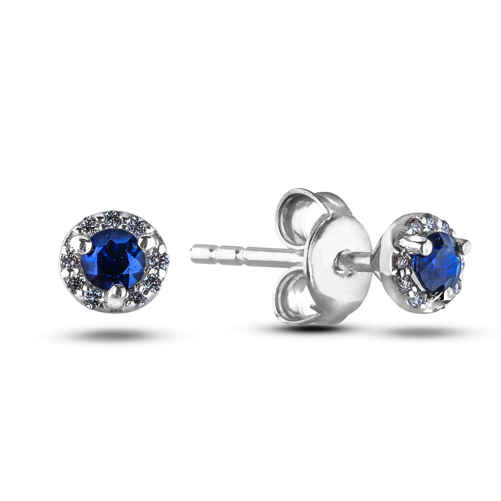 Silver earrings with blue sapphires and surrounding canadian diamonds halo style on a white background , butterfly backing
