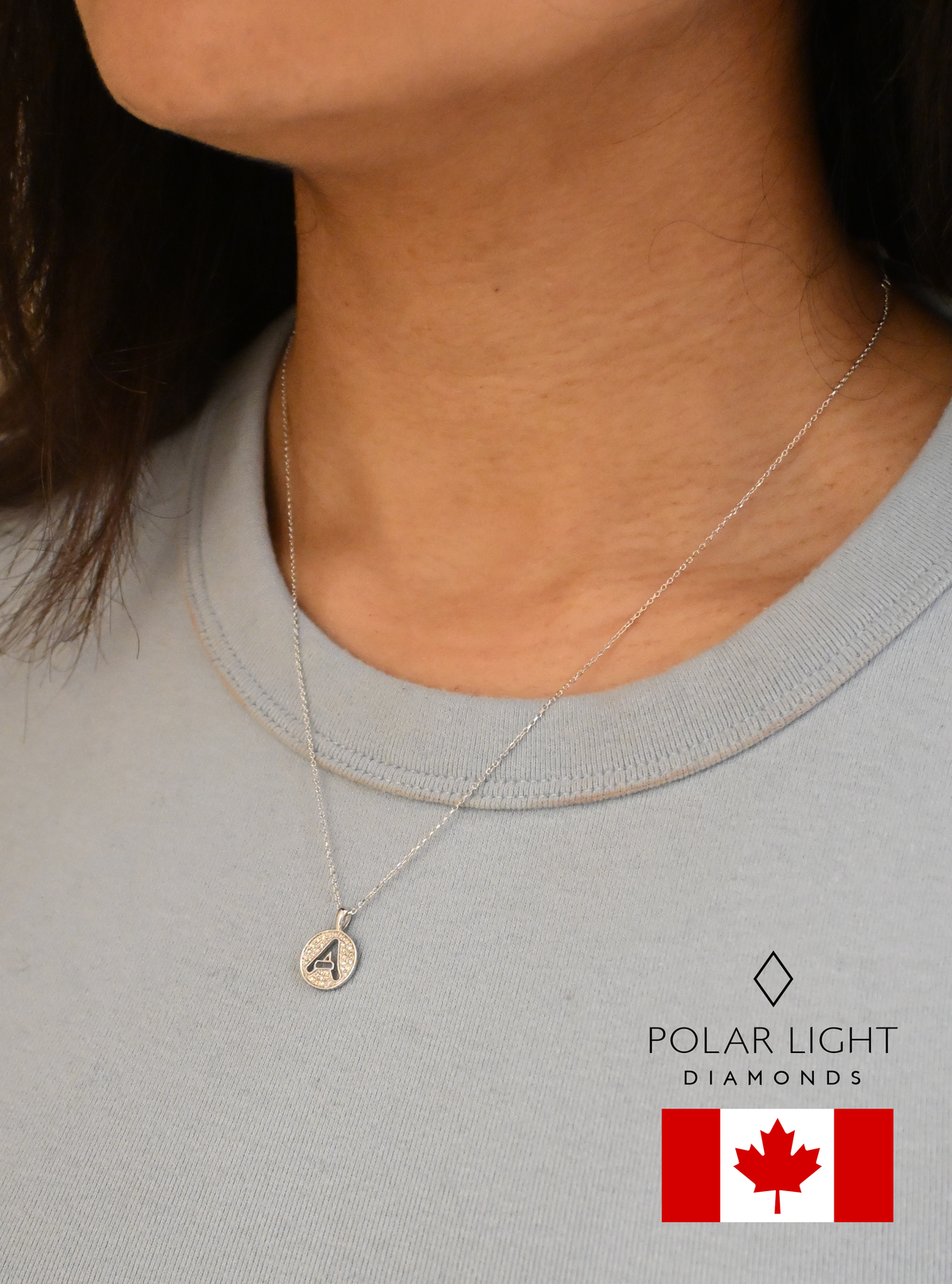 10K White Gold Letter A 0.18 Cttw Round Brilliant Canadian Diamonds Alphabet Initial Pendant and Chain (H-I Color, SI1-I1 Clarity) worn by a person, branded 'Polar Light Diamonds', with a Canadian flag in the corner.