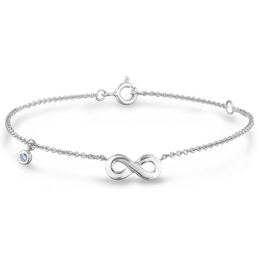 Sterling silver chain bracelet featuring a round brilliant cut, canadian diamond and an infinity symbol charm.