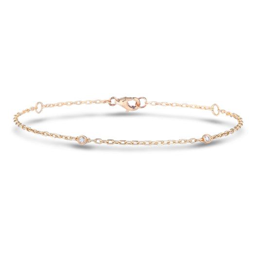 10k Gold bracelet with  three diamonds on a white background