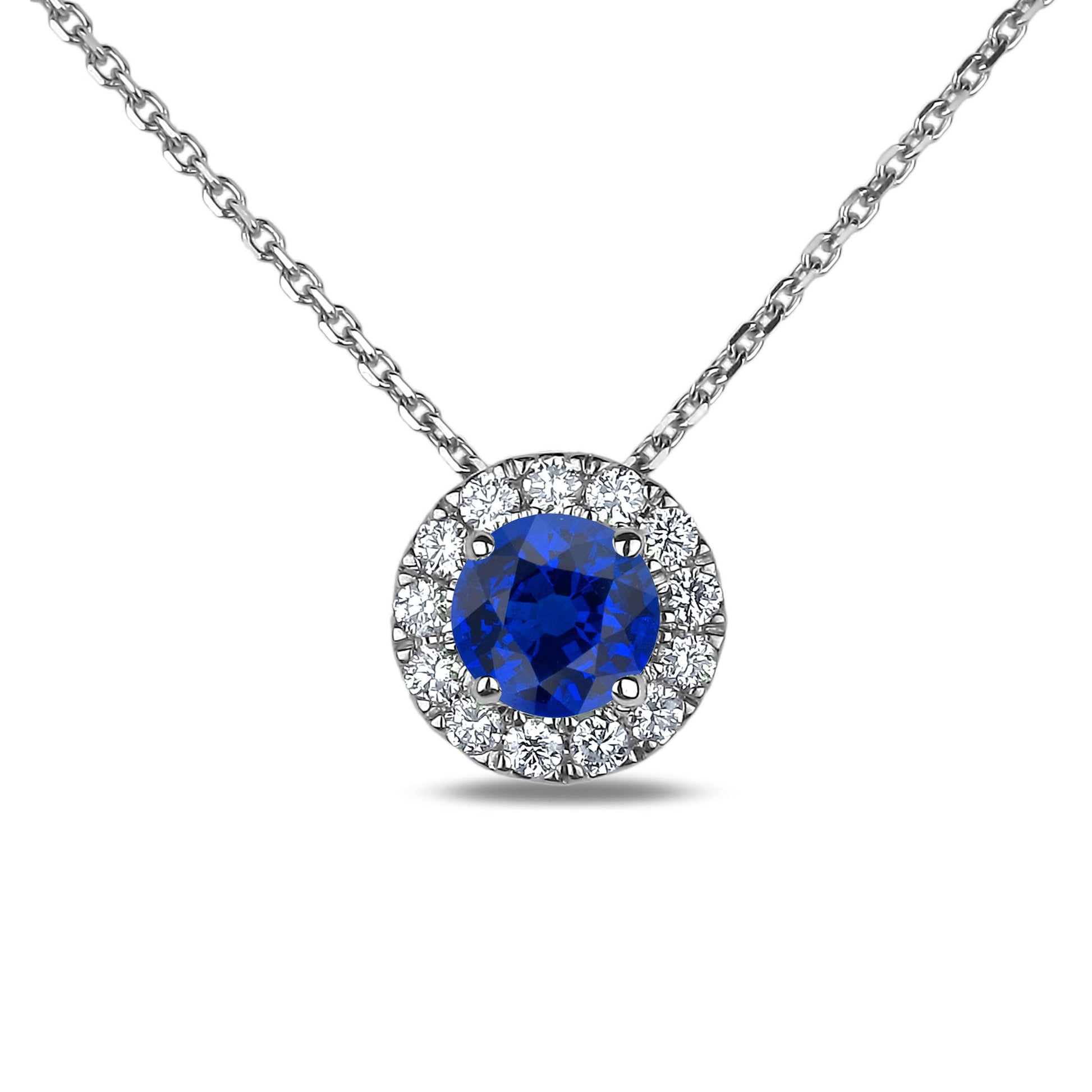 Halo Pendant with rolo chain, a blue sapphire and diamond accents on a white background
