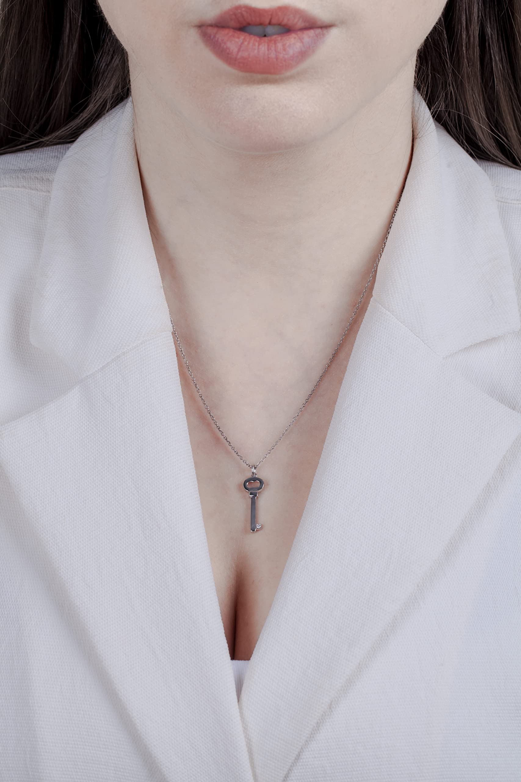 Picture of model wearing Sterling silver key pendant.