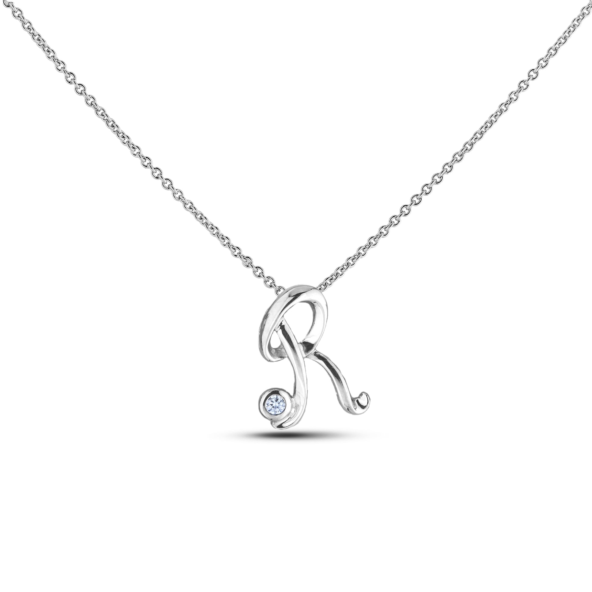Sterling silver Canadian diamond pendant necklace featuring a script alphabet letter R design, displayed on a matching silver rolo chain.

