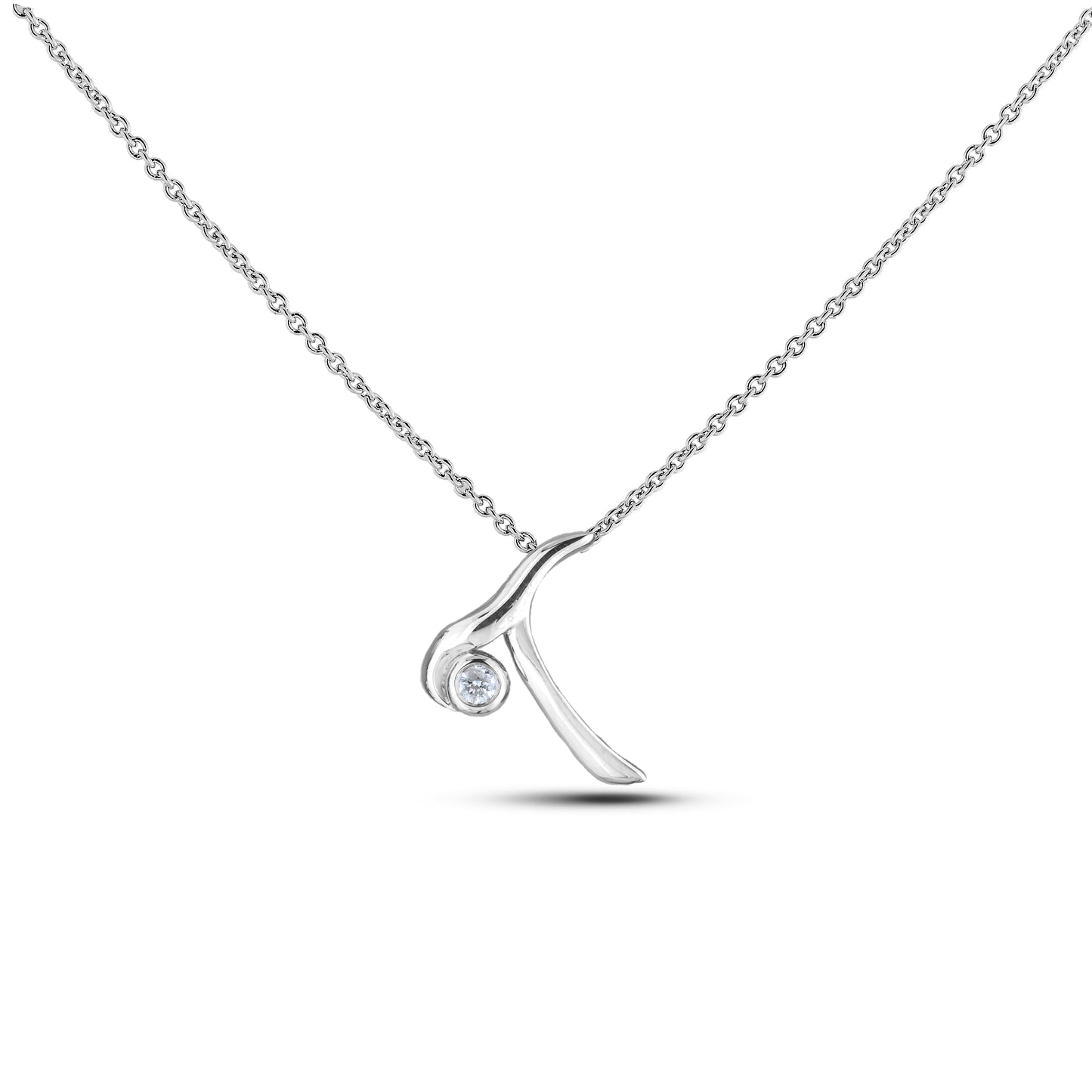 Sterling silver Canadian diamond pendant necklace featuring a script alphabet letter T design, displayed on a matching silver rolo chain.

