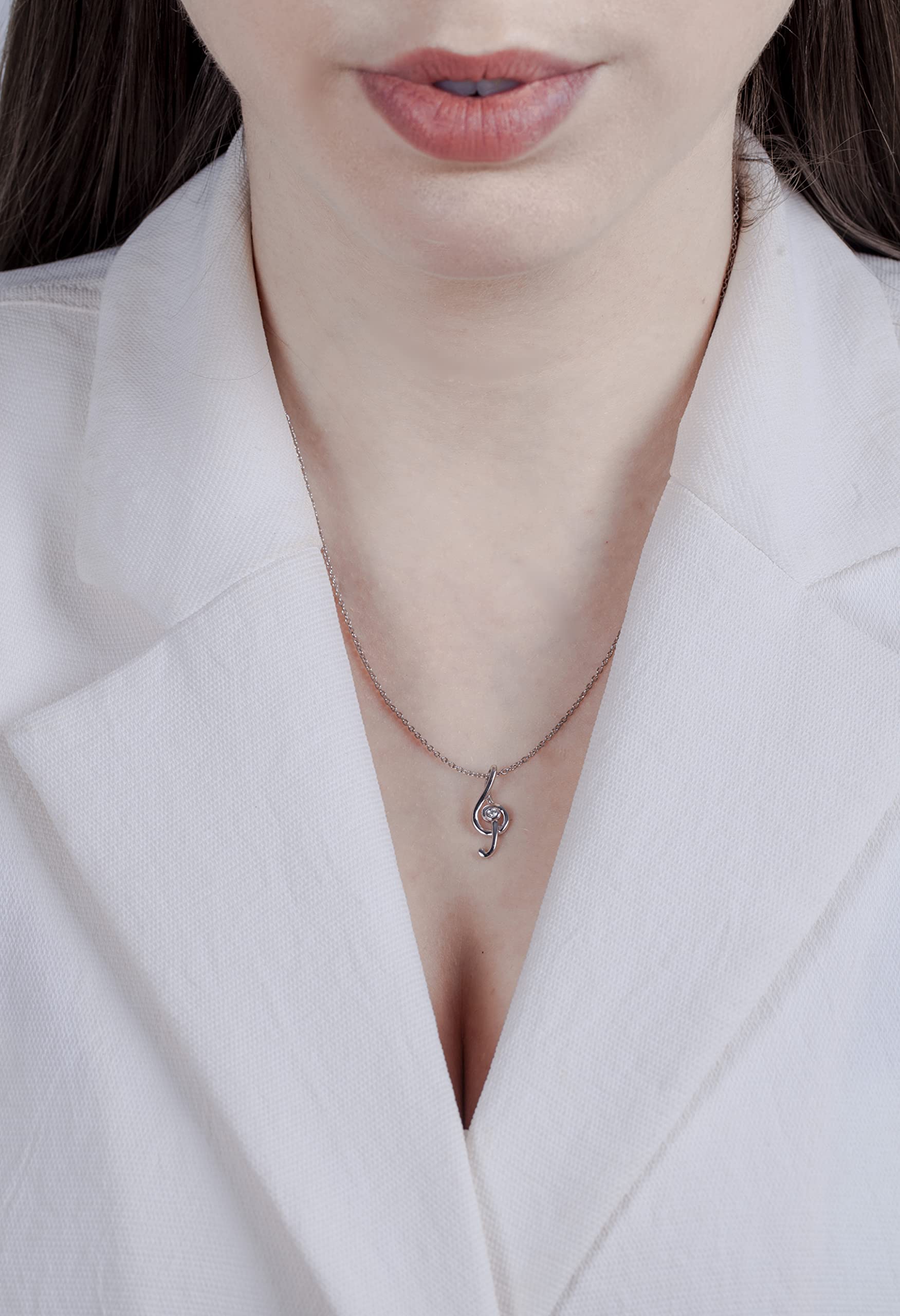 picture of model wearing a music note pendant necklace with Canadian diamond.