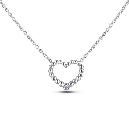 Sterling silver heart pendant featuring a round brilliant cut, canadian diamond.