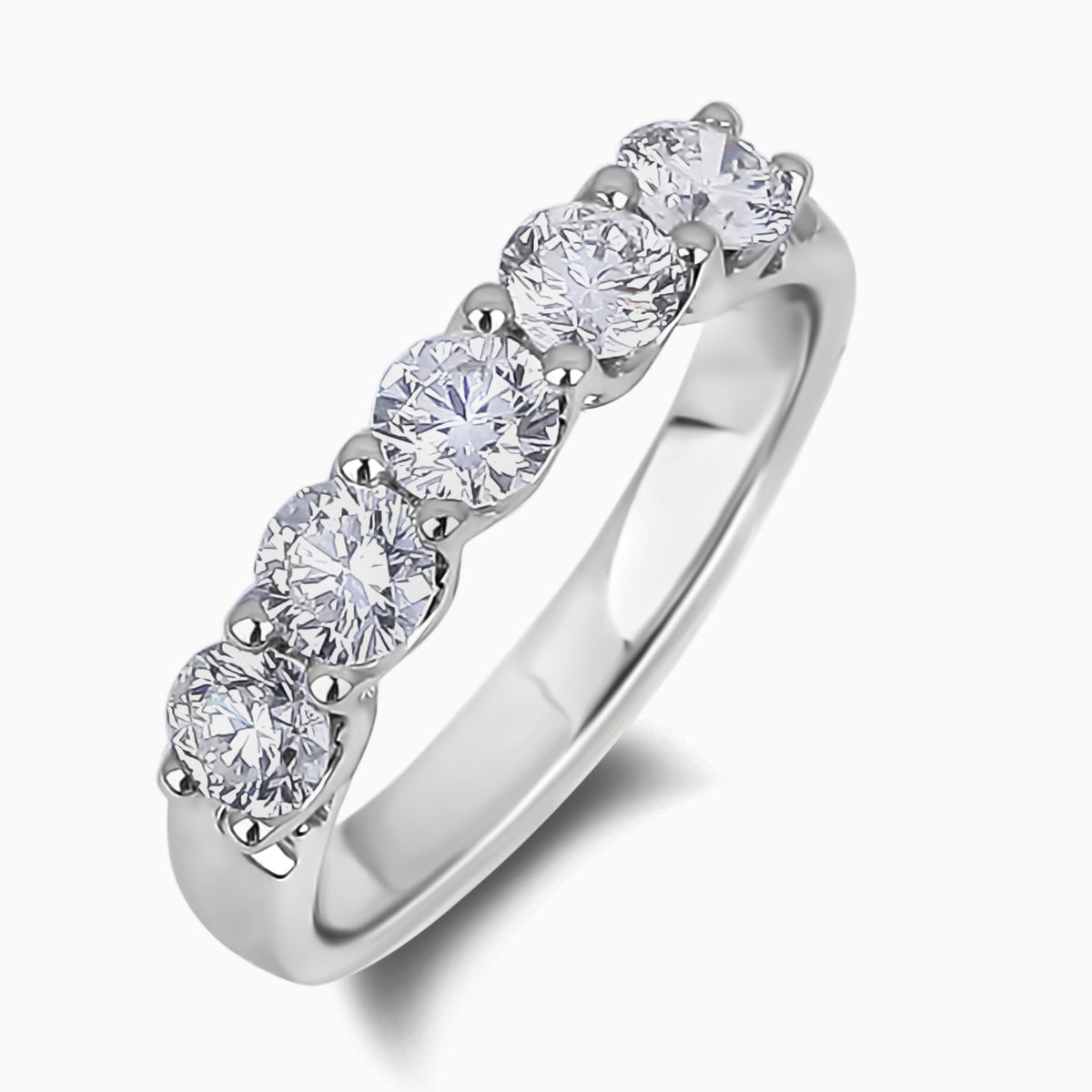 Close-up shot detailing the five matching colorless diamonds set across the band of an 18K white gold ring, showing brilliant sparkle and flawless clarity.