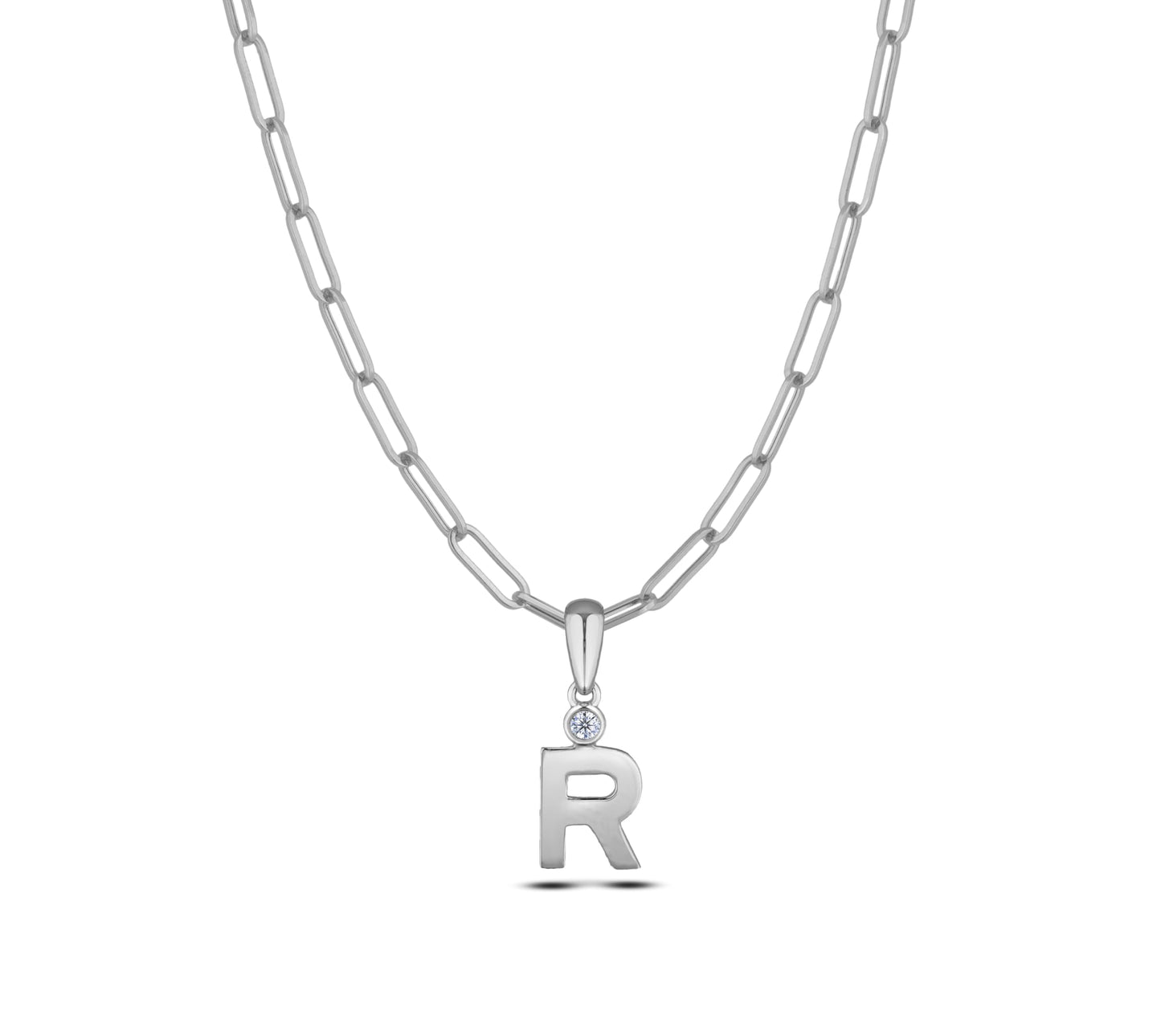 Sterling silver Canadian diamond pendant necklace featuring a black style letter R design, displayed on a matching silver paperclip chain.

