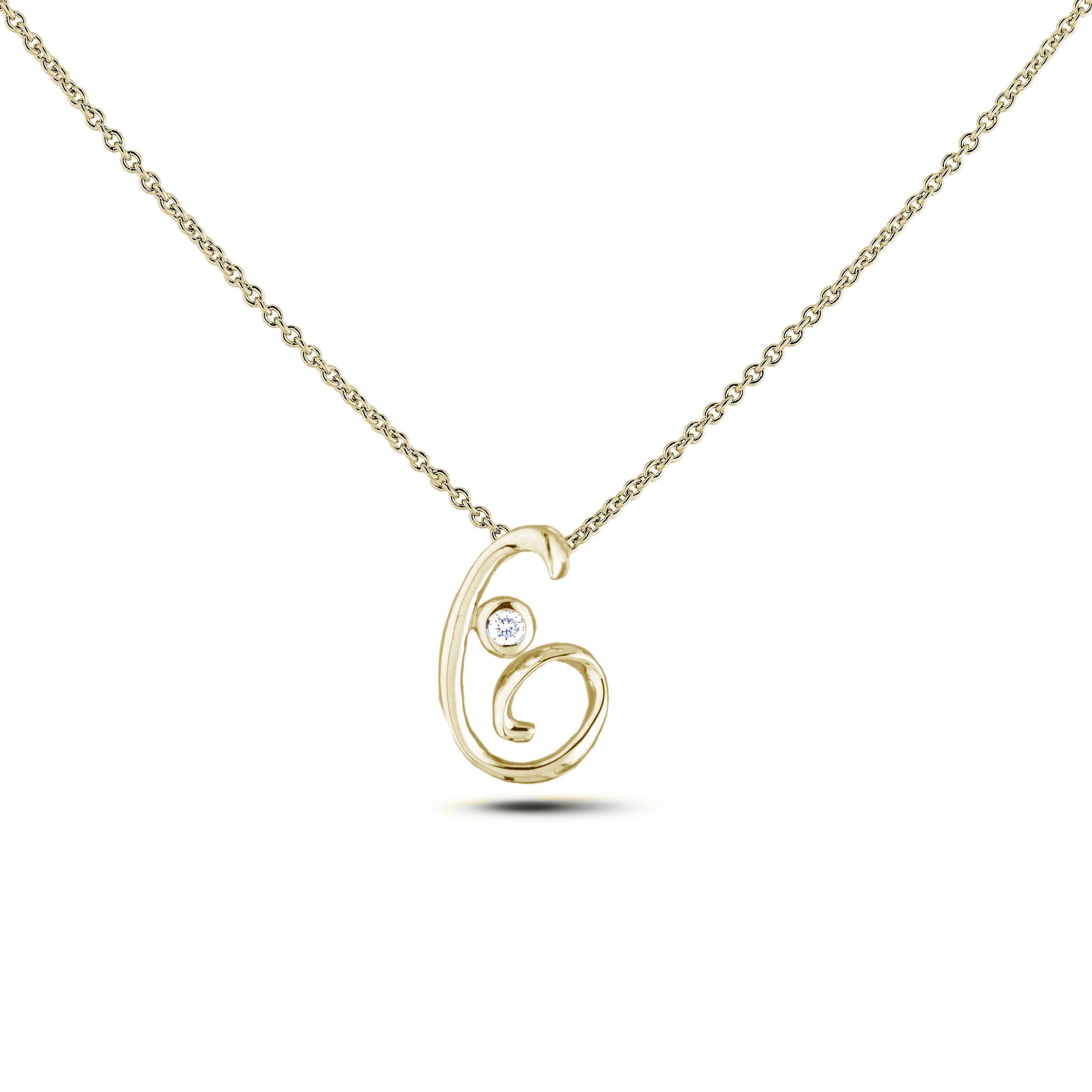 Yellow Gold Canadian diamond pendant necklace featuring a script alphabet letter G design, displayed on a matching silver rolo chain.

