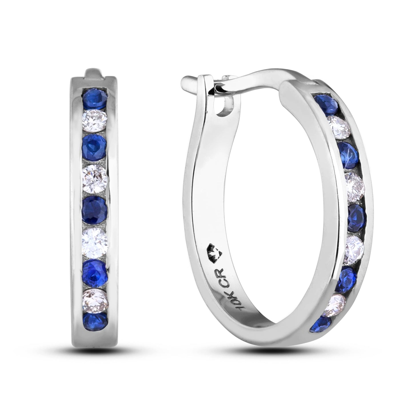 A pair of 10K white gold huggie hoop earrings featuring an alternating channel-set design of 1/6 Cttw blue sapphires and 1/10 Cttw natural diamonds. The earrings are designed with a secure latch back post for a comfortable, seamless fit.