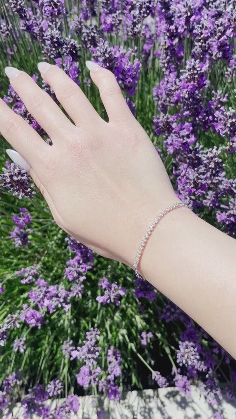 showcase video of model wearing 925 Sterling Silver 0.22 CTW Canadian Diamond Half Tennis Paperclip Bracelet