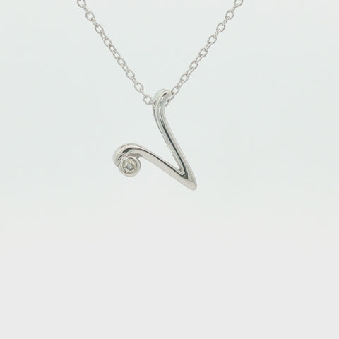 Rotating 360-degree view of a script letter V initial pendant necklace in 925 sterling silver with a certified Canadian diamond on a rolo chain.
