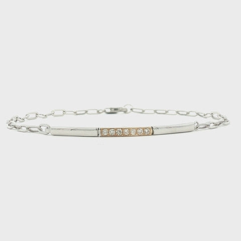 rotating video of 10K Yellow Gold and 925 Sterling Silver 0.09 CTW Canadian Diamond Two Tone Paperclip Bracelet, showing the sparkle and structure of the bracelet.