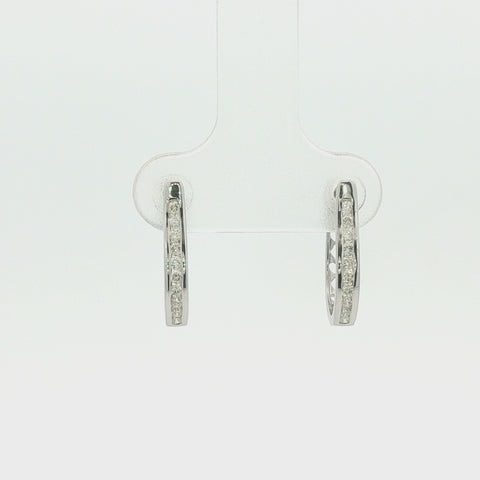 Rotating view of 10K white gold hoop earrings with channel-set Canadian diamonds, totaling 0.22 carats, showcasing the design from every angle.