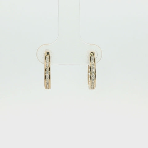 Rotating view of 10K yellow gold hoop earrings with channel-set Canadian diamonds, totaling 0.22 carats, showcasing the design from every angle.