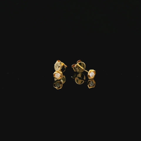 Rotation video of 10k yellow gold rose stud earrings with butterfly backing and solitaire diamonds 