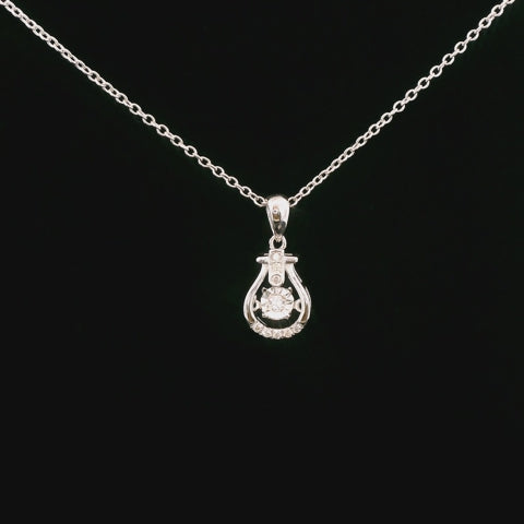 video of rotating silver diamond necklace with center dancing diamond and rolo chain from all angles, showcasing sparkle