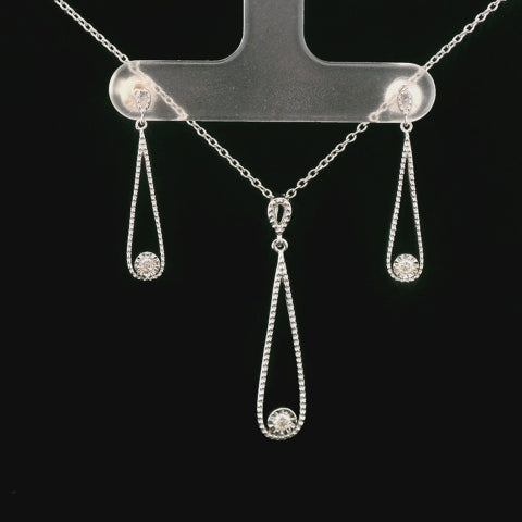 Rotating video of milgrain detail with miracle setting Canadian diamond jewelry set, dangle earrings and pendant 