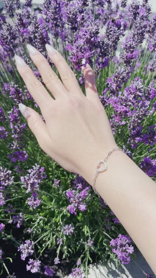 video of model wearing 925 Sterling Silver Open Heart 0.25 Cttw Canadian Diamond Paperclip Bracelet