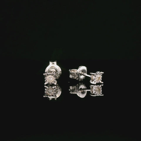 A rotating video of a pair of 925 sterling silver stud earrings with butterfly backings featuring Canadian diamonds. The diamonds are housed in miracle settings that enhance their size and sparkle as they catch the light. 