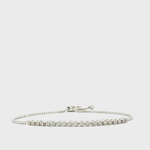 Rotating view of a sterling silver tennis bracelet with 0.20 carats of Canadian diamonds, highlighting its adjustable bolo chain and star-detailed clasp.