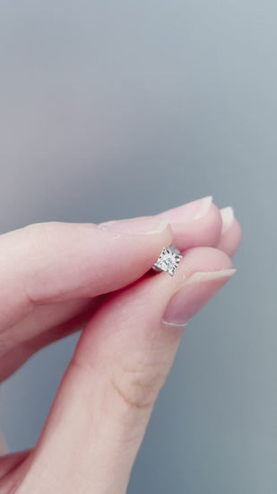 Product review and showcase video for the Sterling Silver 0.06 Cttw Canadian Diamond Miracle-Setting Solitaire Stud Earrings. Includes close-up views in natural sunlight highlighting the miracle plate setting and diamond sparkle (H-I color, SI2-I1 clarity), along with an on-model video showing ear placement and scale.
