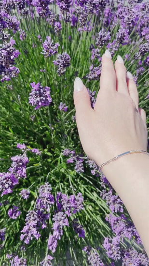 video of 10K Yellow Gold and 925 Sterling Silver 0.09 CTW Canadian Diamond Two Tone Paperclip Bracelet 